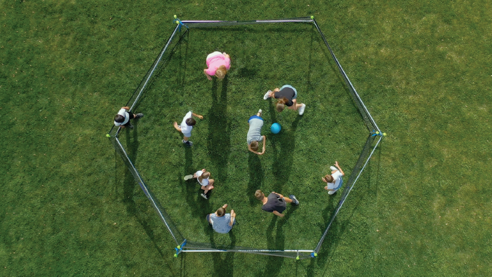 https://castlesports.com/cdn/shop/articles/Gaga_Ball_-_Froggy_Ball_Seen_From_Above_on_Grass_During_a_Fun_Game.png?v=1748881279