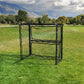 Panna soccer cage frame on a field surrounded by trees