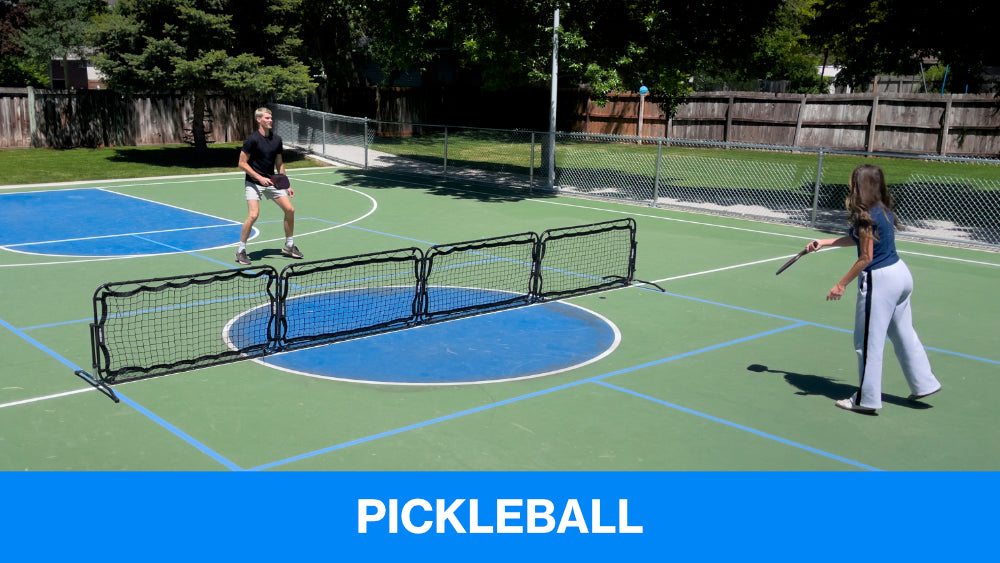 two people playing pickleball with infinets portable pickleball nets