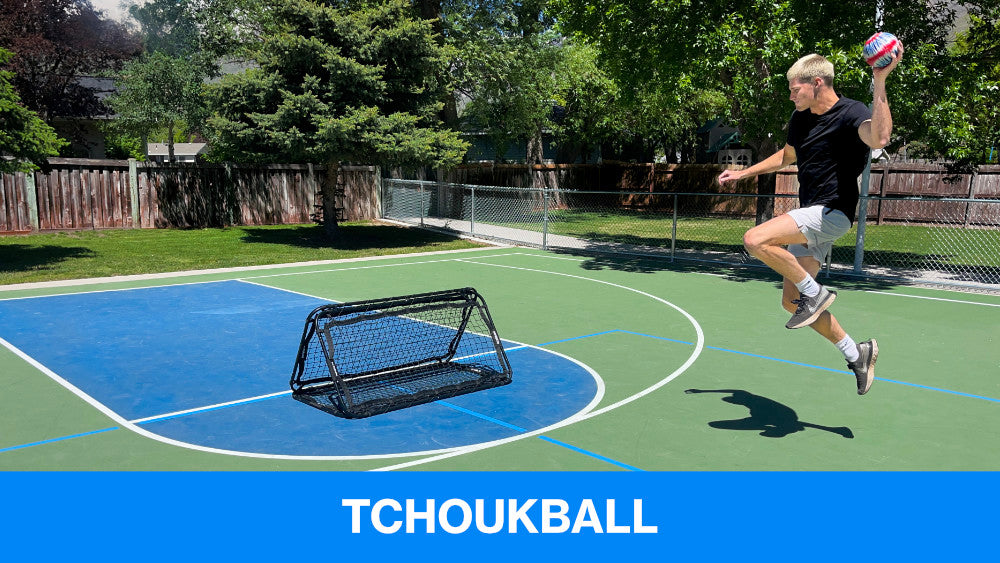 guy jumping with a tchoukball looking at tchoukball net