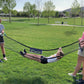 Kids using Gaga Ball net as a hammock